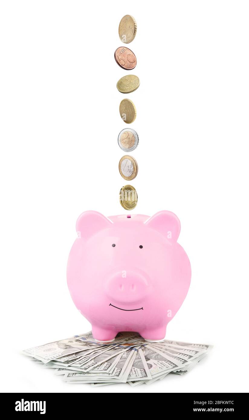 Pink piggy bank with coins falling into slot isolated on white Stock ...