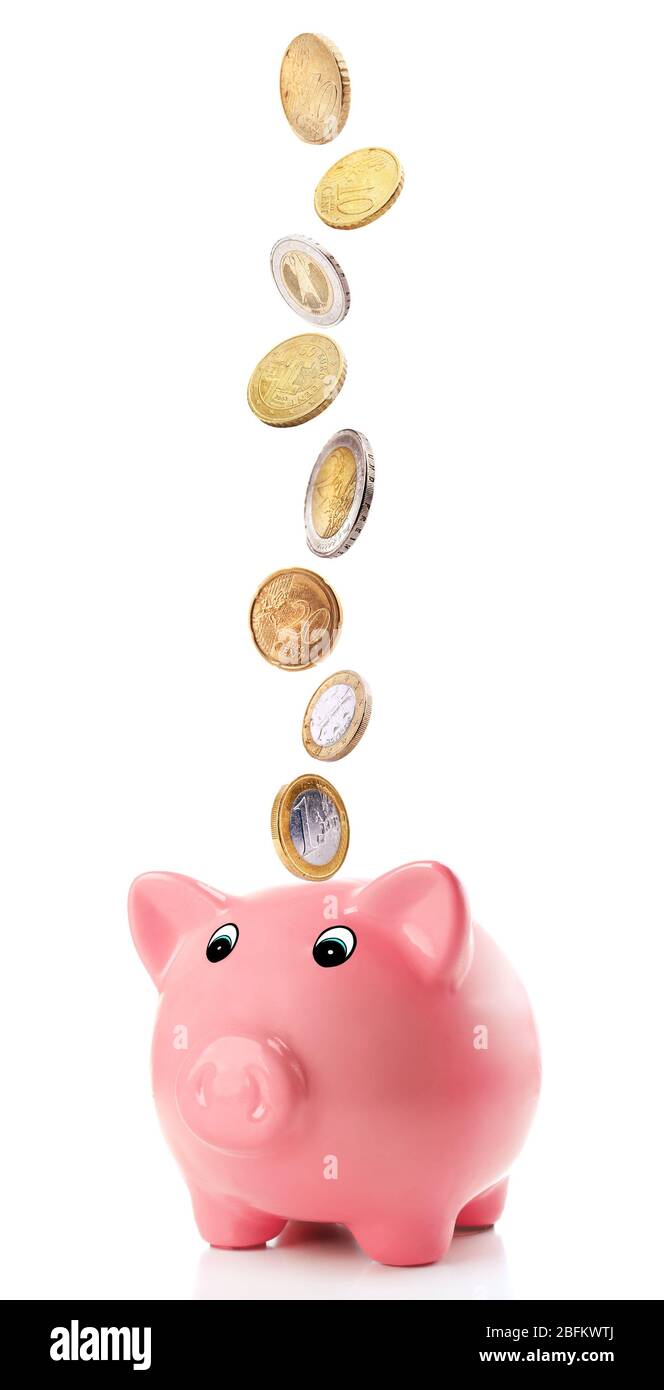 Pink piggy bank with coins falling into slot isolated on white Stock ...