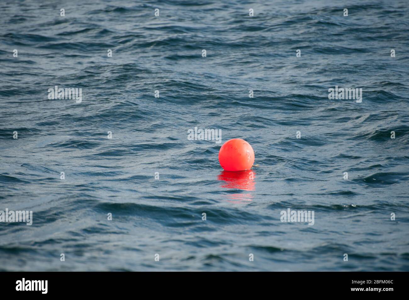 A bouy in the sea marking the location of fishing nets.. Stock Photo
