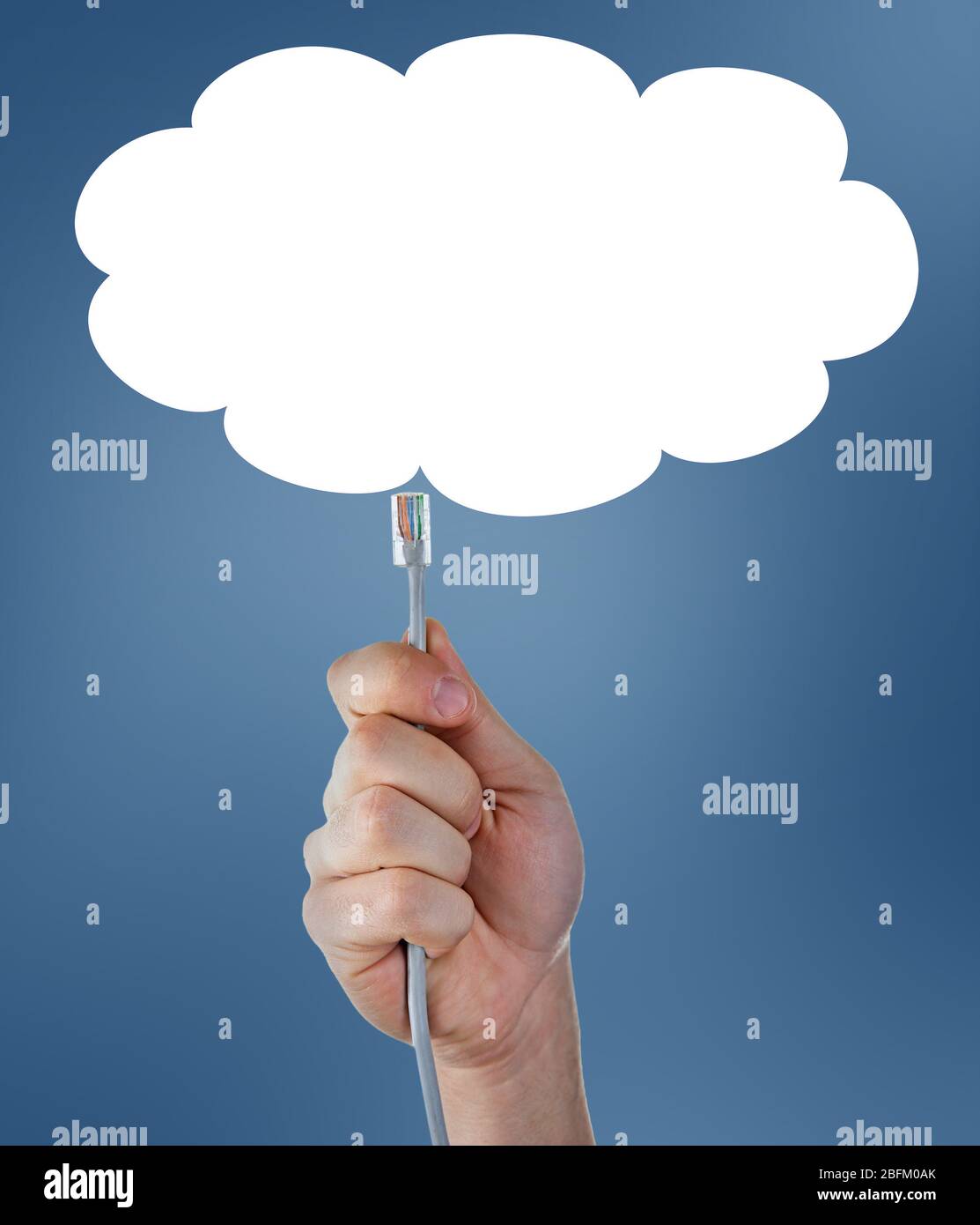 Internet cable in hand on blue sky background with cloud Stock Photo