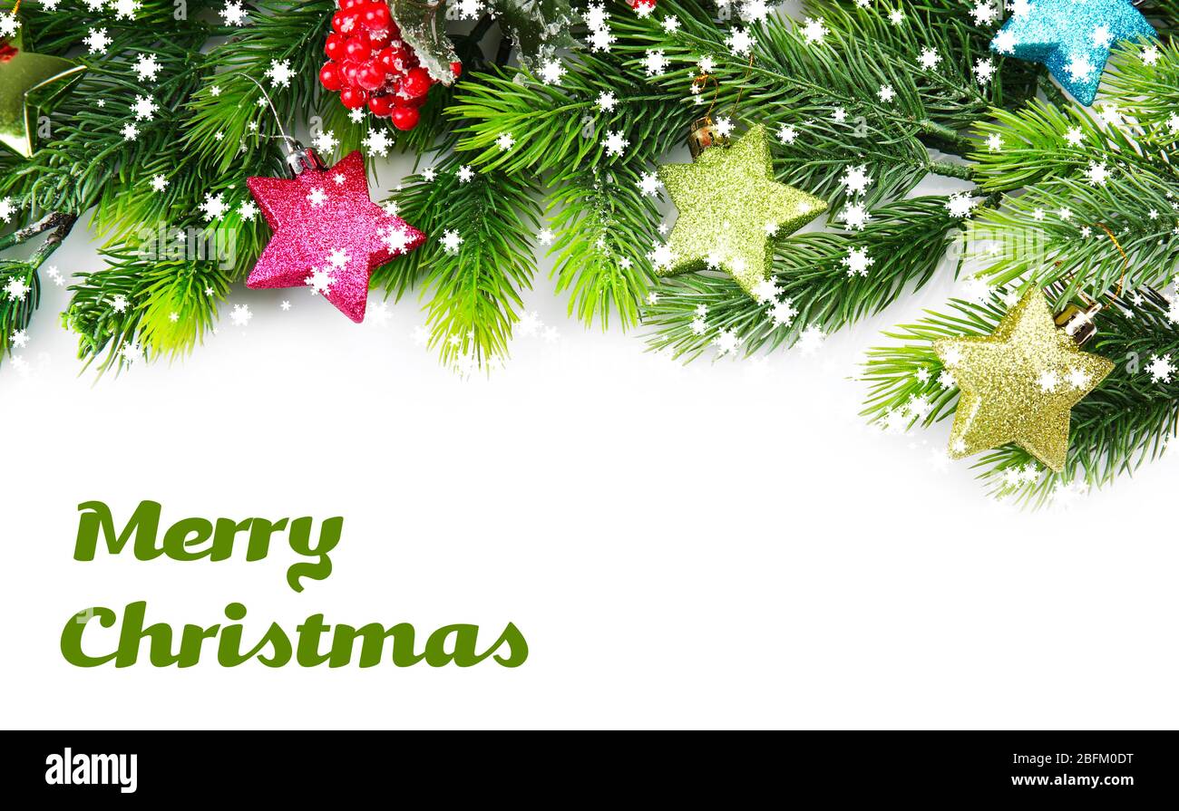Christmas tree branch with red berries and decorations on white ...