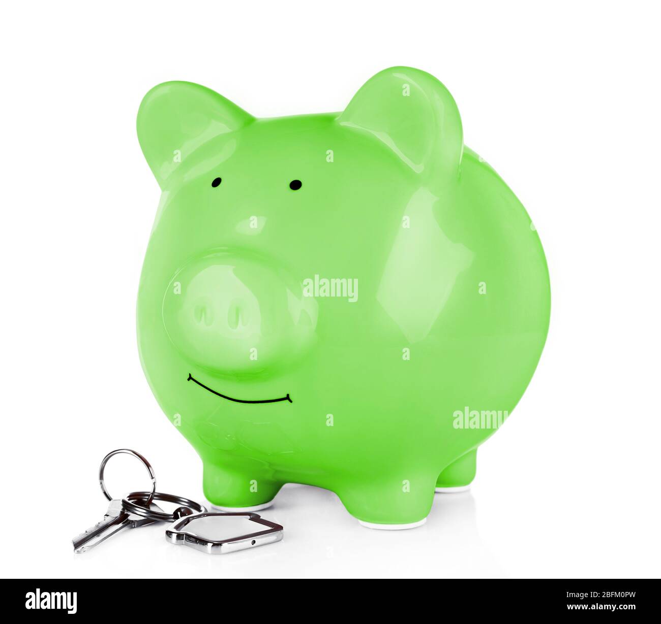 Piggy bank style money box with key isolated on a white Stock Photo - Alamy