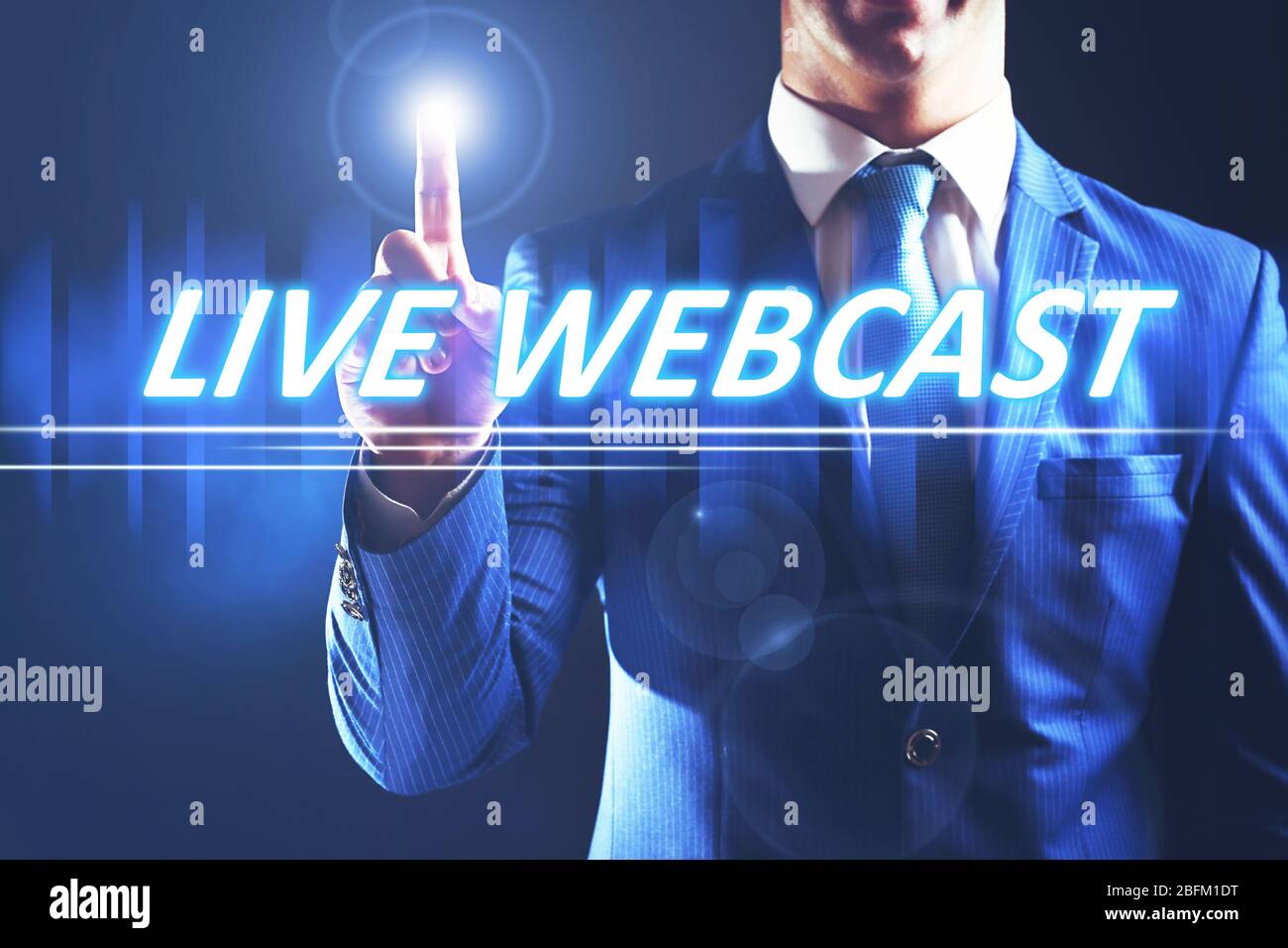 Businessman pressing live webcast button on virtual screen. Internet and networking concept. Stock Photo