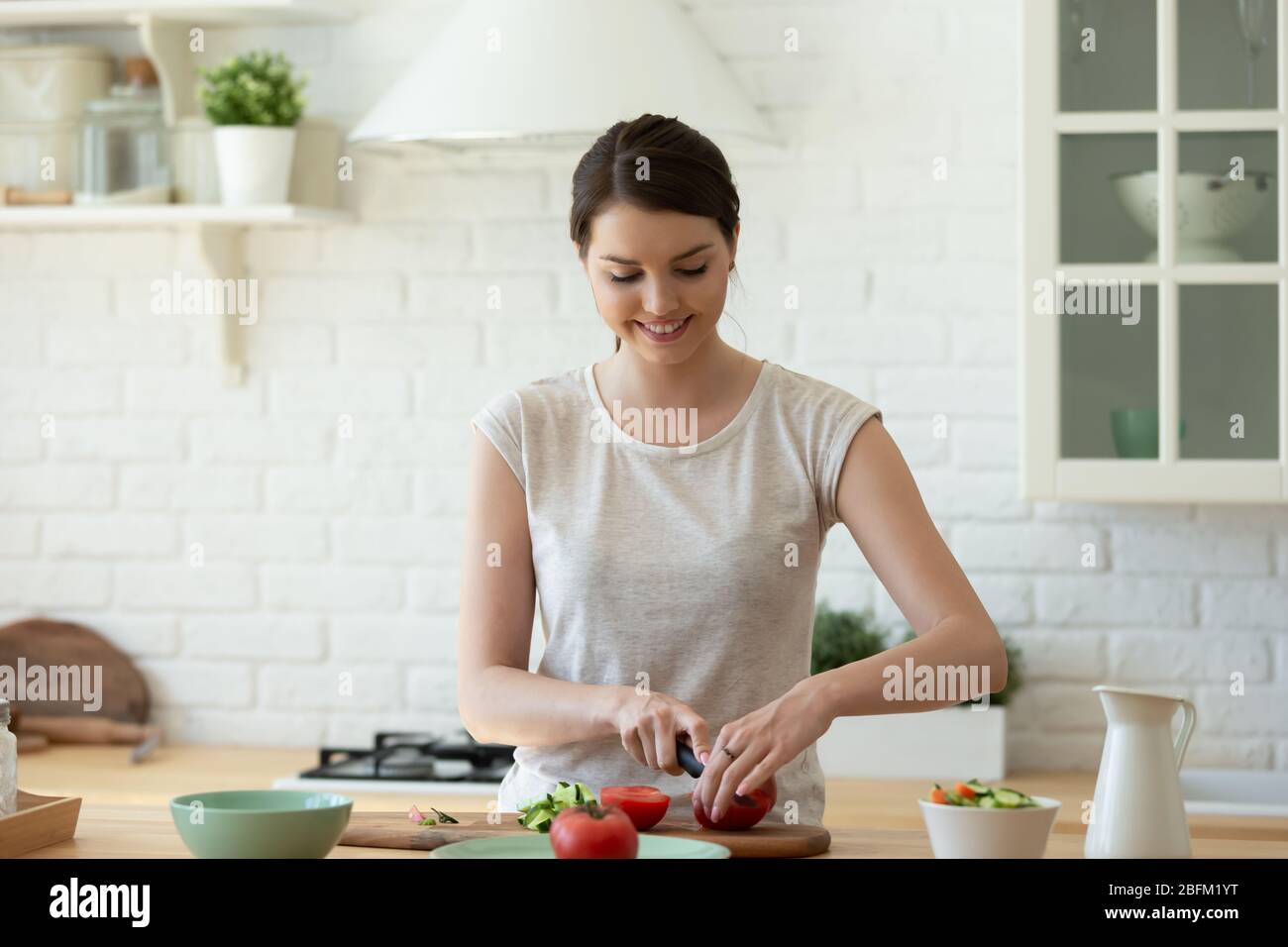 Woman cooking meal kitchen busy hi-res stock photography and images - Alamy
