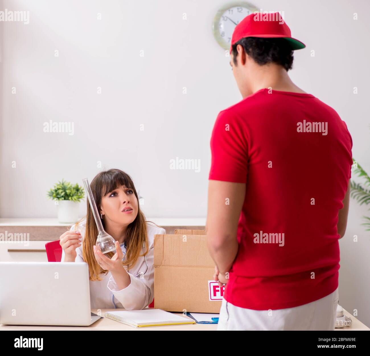 The courier delivering urgent parcel to the hospital Stock Photo Alamy