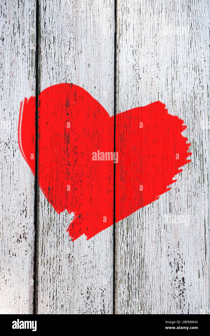 Red heart painted on old wooden wall background Stock Photo - Alamy