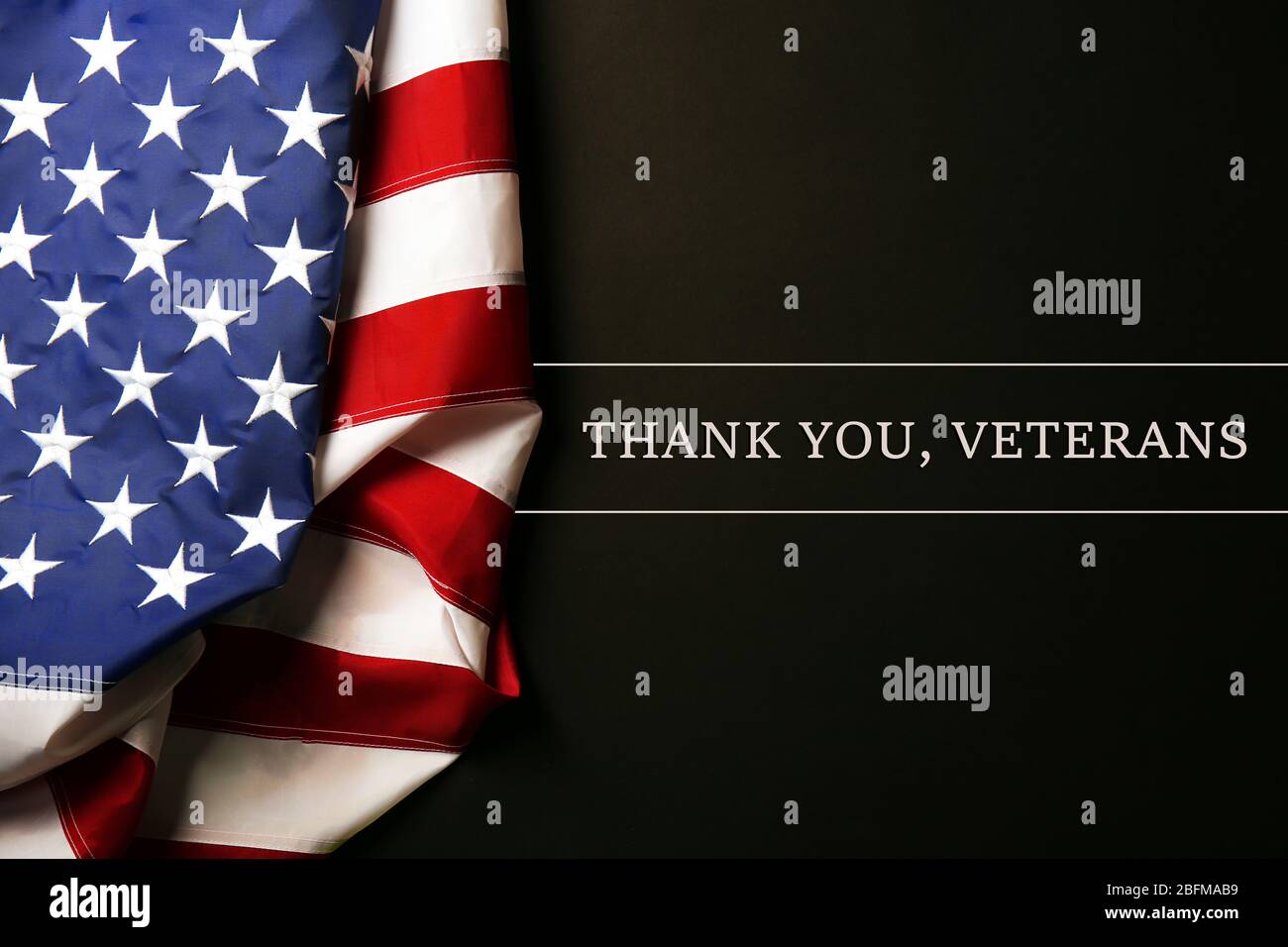 Text Thank A You, Veterans on black background near American flag Stock ...