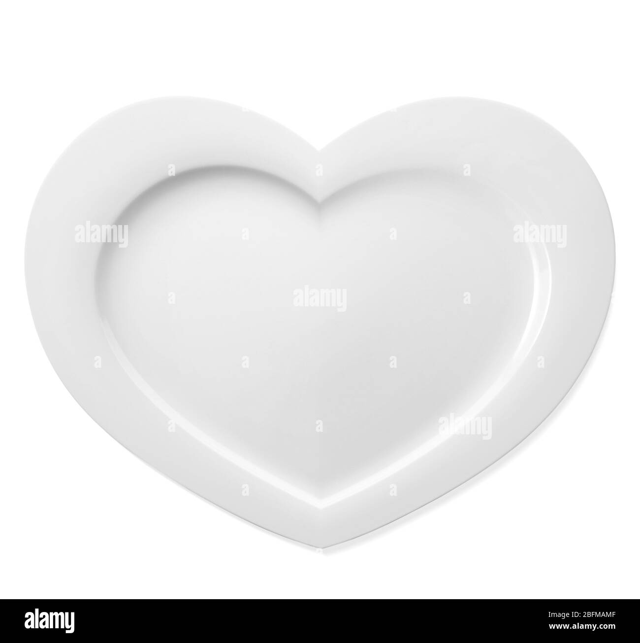 Plate in shape of heart isolated on white Stock Photo - Alamy