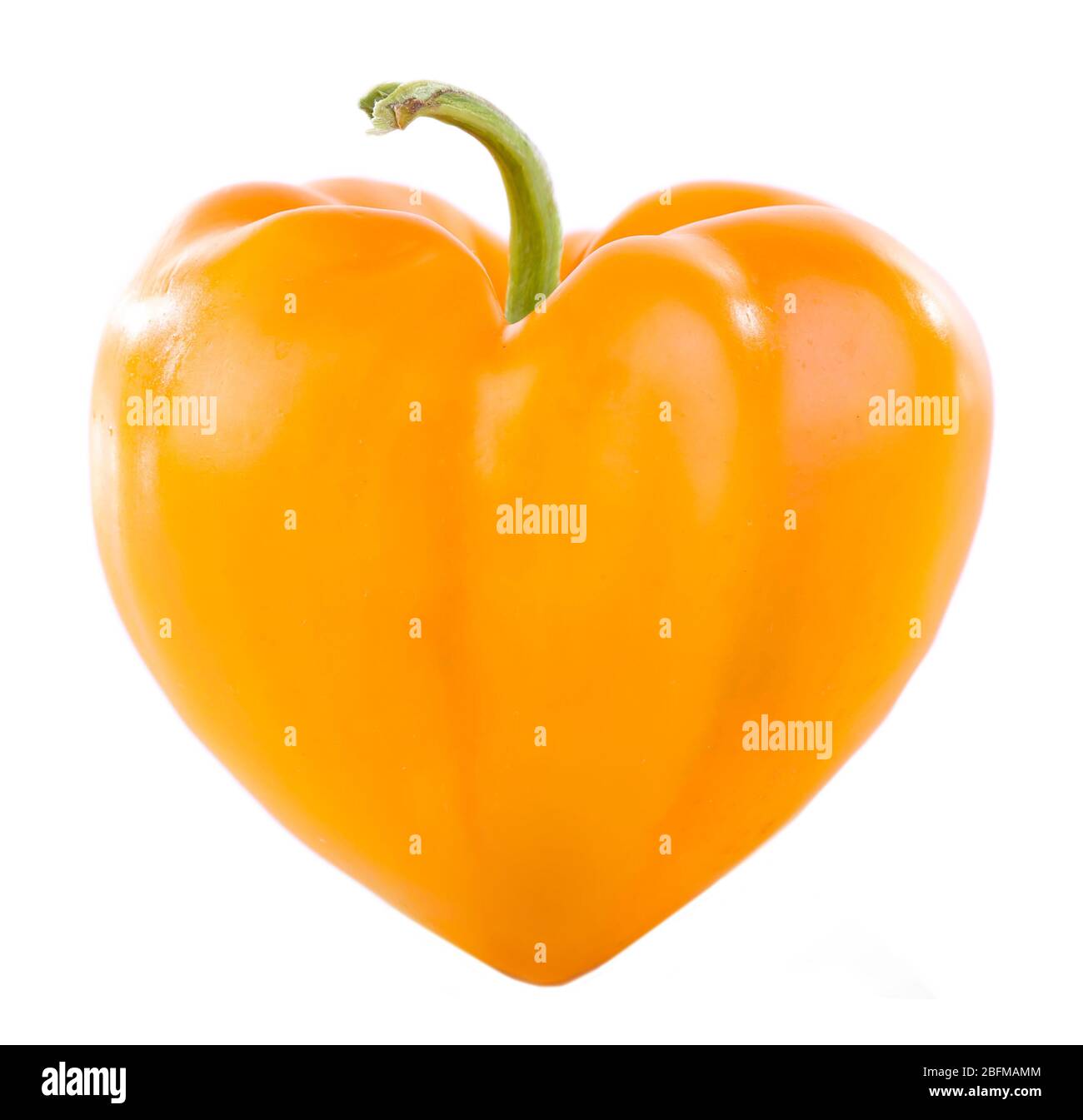 Yellow pepper in heart shape isolated on white Stock Photo - Alamy