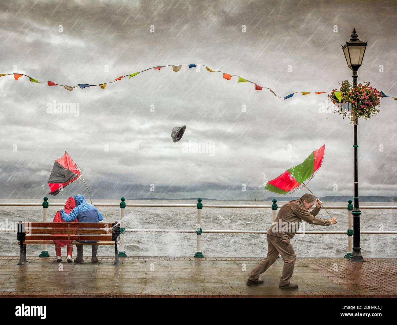 Not a good day for umbrellas. Extreme weather with humour. Stock Photo