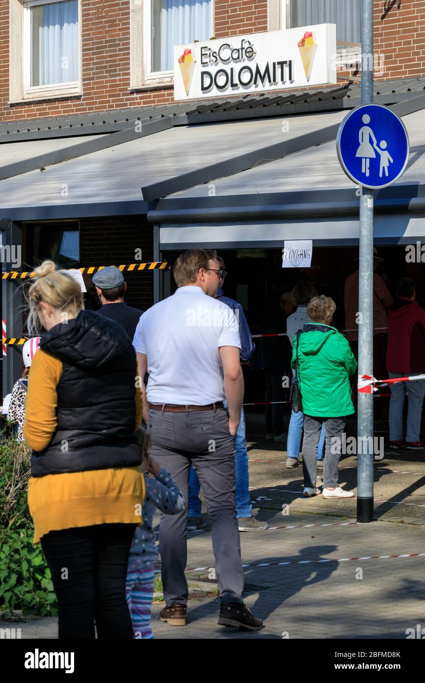 Haltern am See, NRW, Germany. 19th Apr, 2020. A long queue has formed outside Italian ice cream parlour, with people keeping their distance and no more than 2 allowed in at any time. Overall, Germans have so far kept fairly well to social distancing rules and restrictions to public live, with infection rates levelling out slowly and early signs indicating that measures are working. Credit: Imageplotter/Alamy Live News Stock Photo