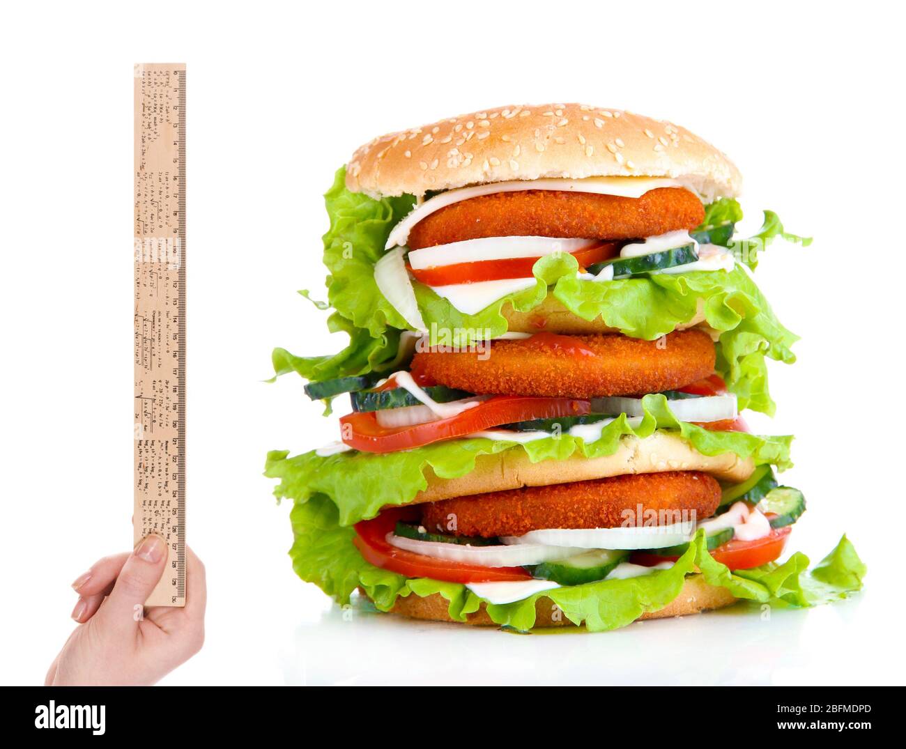 Huge burger and hand with ruler isolated on white Stock Photo - Alamy