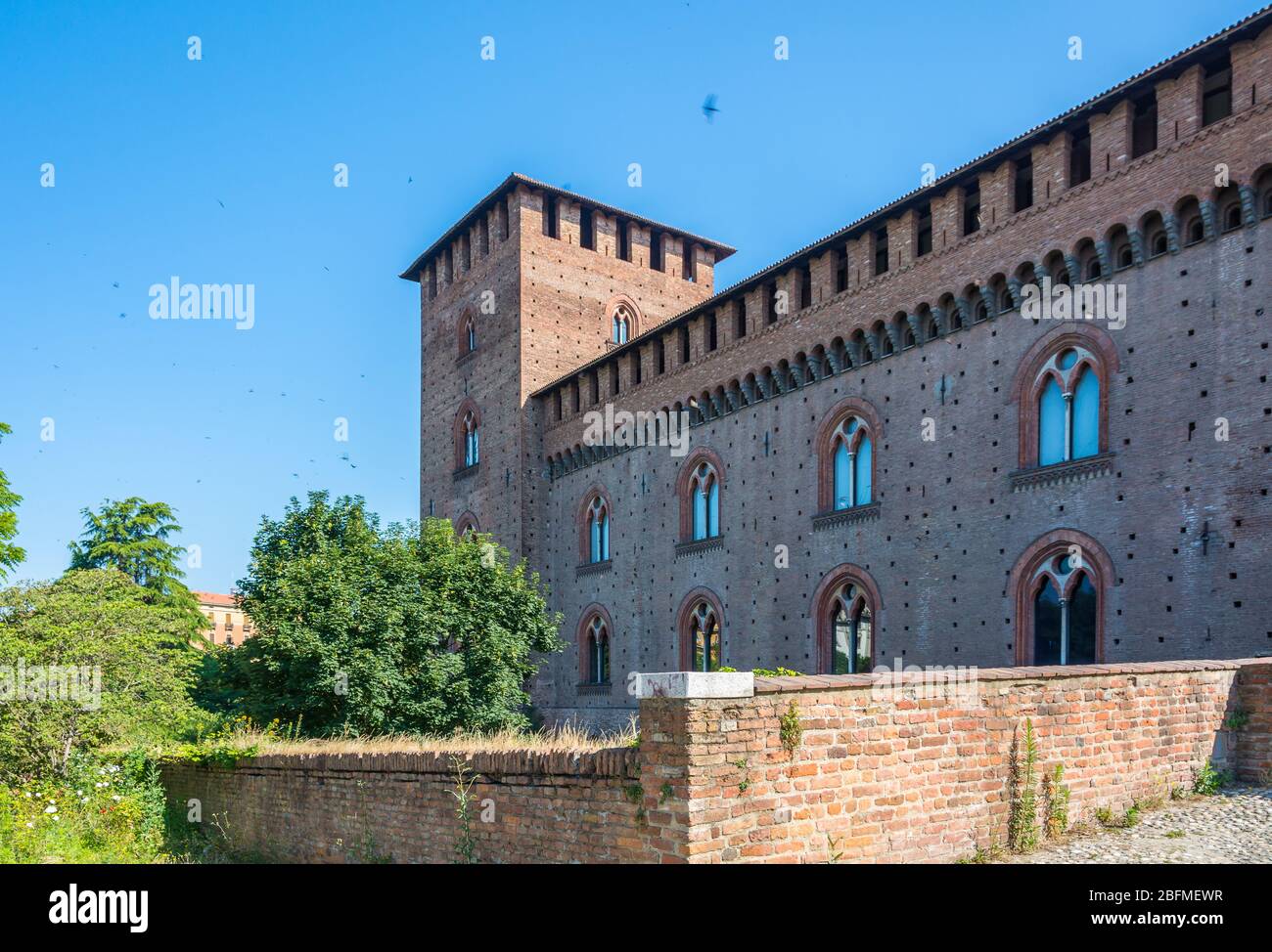 Visconteo Castle. Medieval building with red brick facades. it is a important artistic hub of the city of Pavia, Lombardy, northern Italy Stock Photo