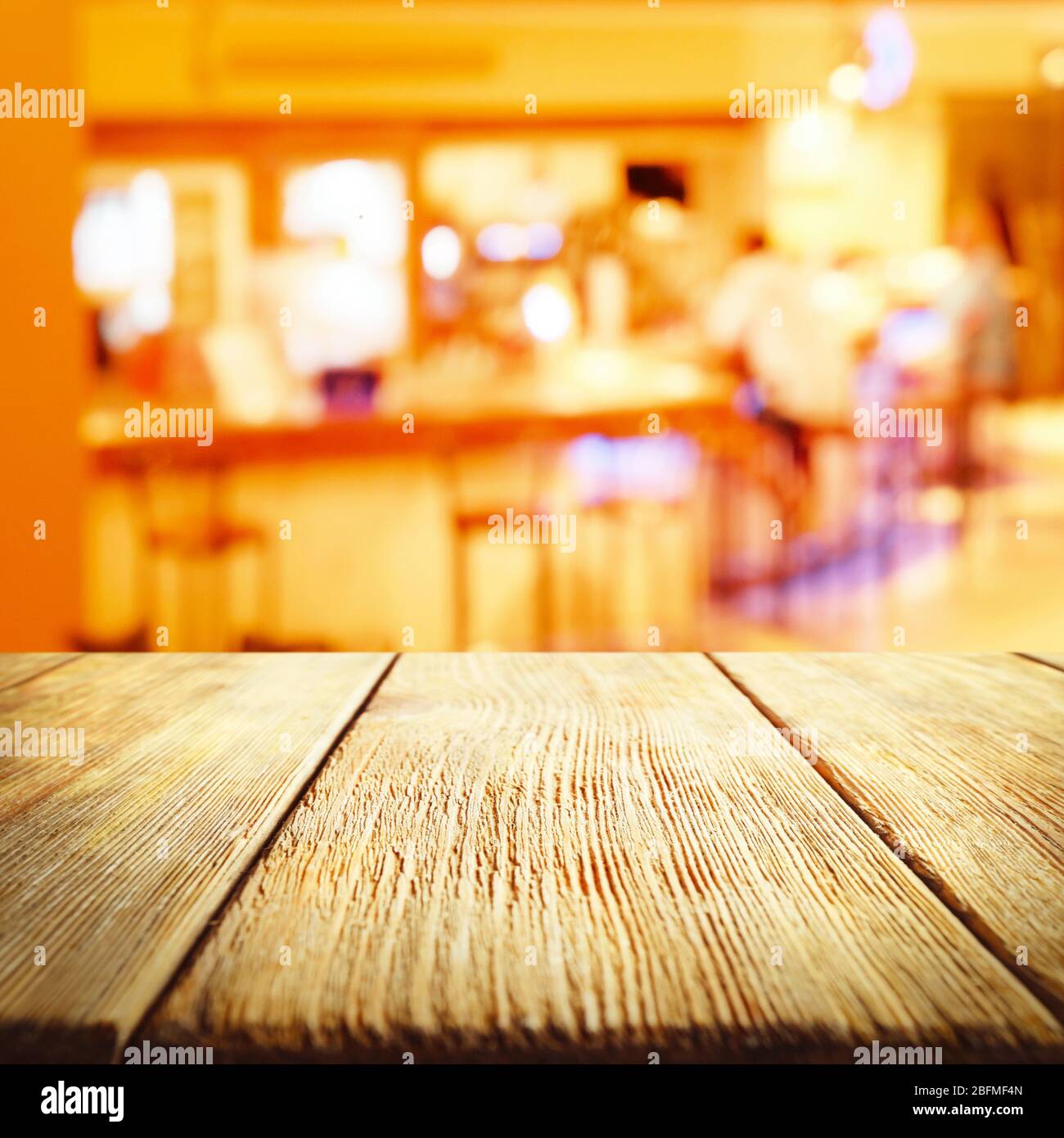 Empty wooden table and blurred cafe interior background Stock Photo - Alamy
