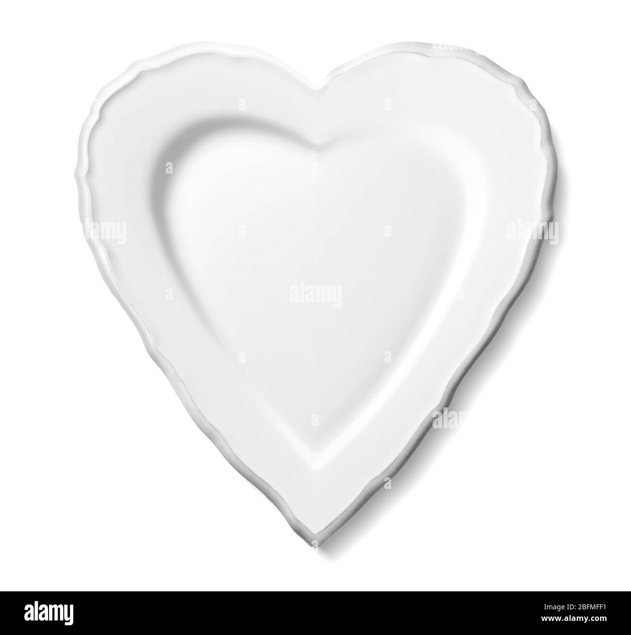 Plate in shape of heart isolated on white Stock Photo - Alamy