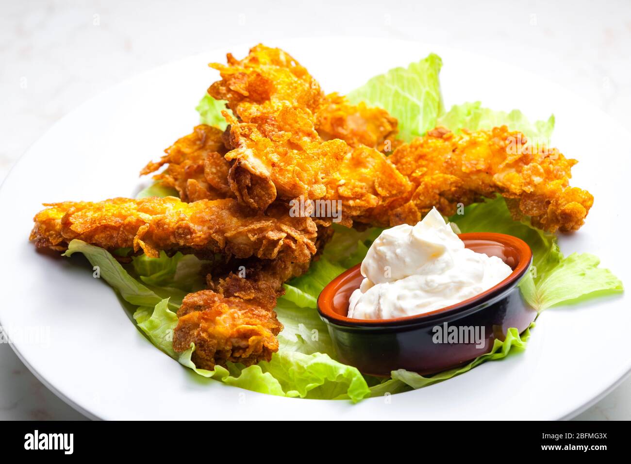 homemade chicken strips with garlic dip Stock Photo Alamy