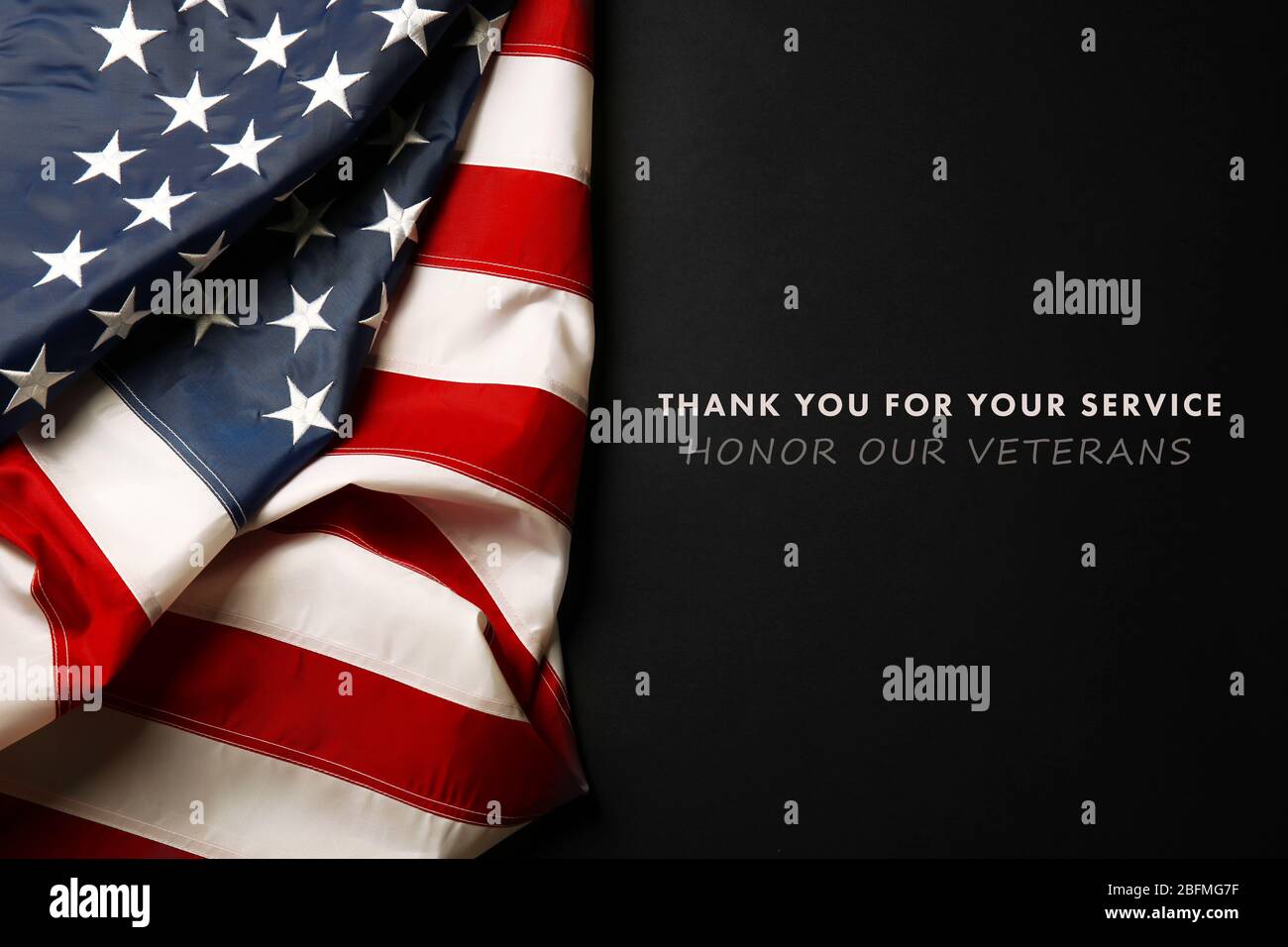 Text Thank You For Your Service on black background near American flag ...