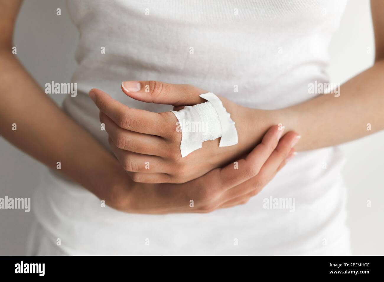 Woman hand with plaster bandage after mandatory medical chipization in  Sweden. Implantation of microchip in hand. Health control of citizens Stock  Photo - Alamy