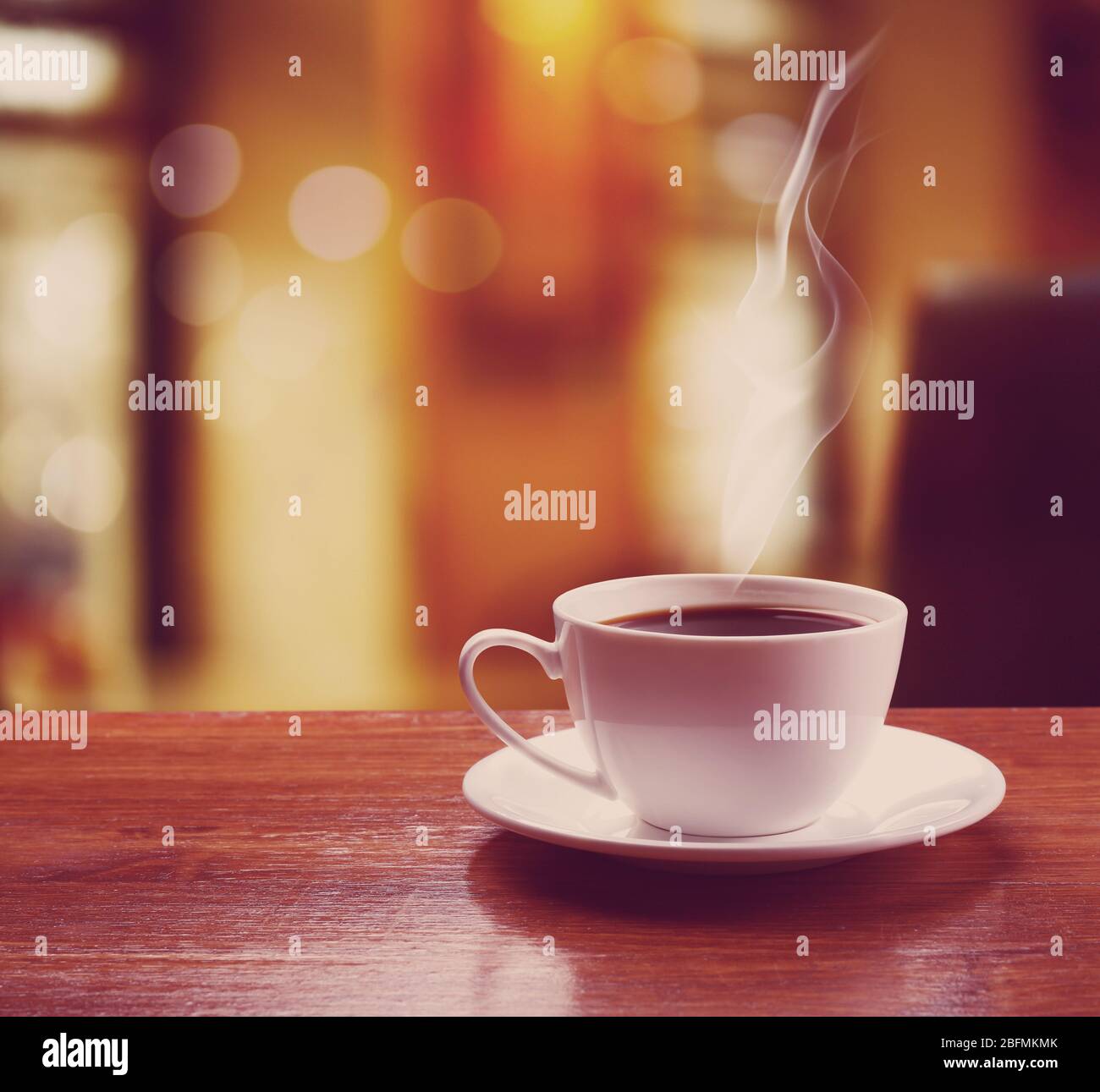 Cup Of Coffee On Table On Blured Cafe Background Stock Photo Alamy