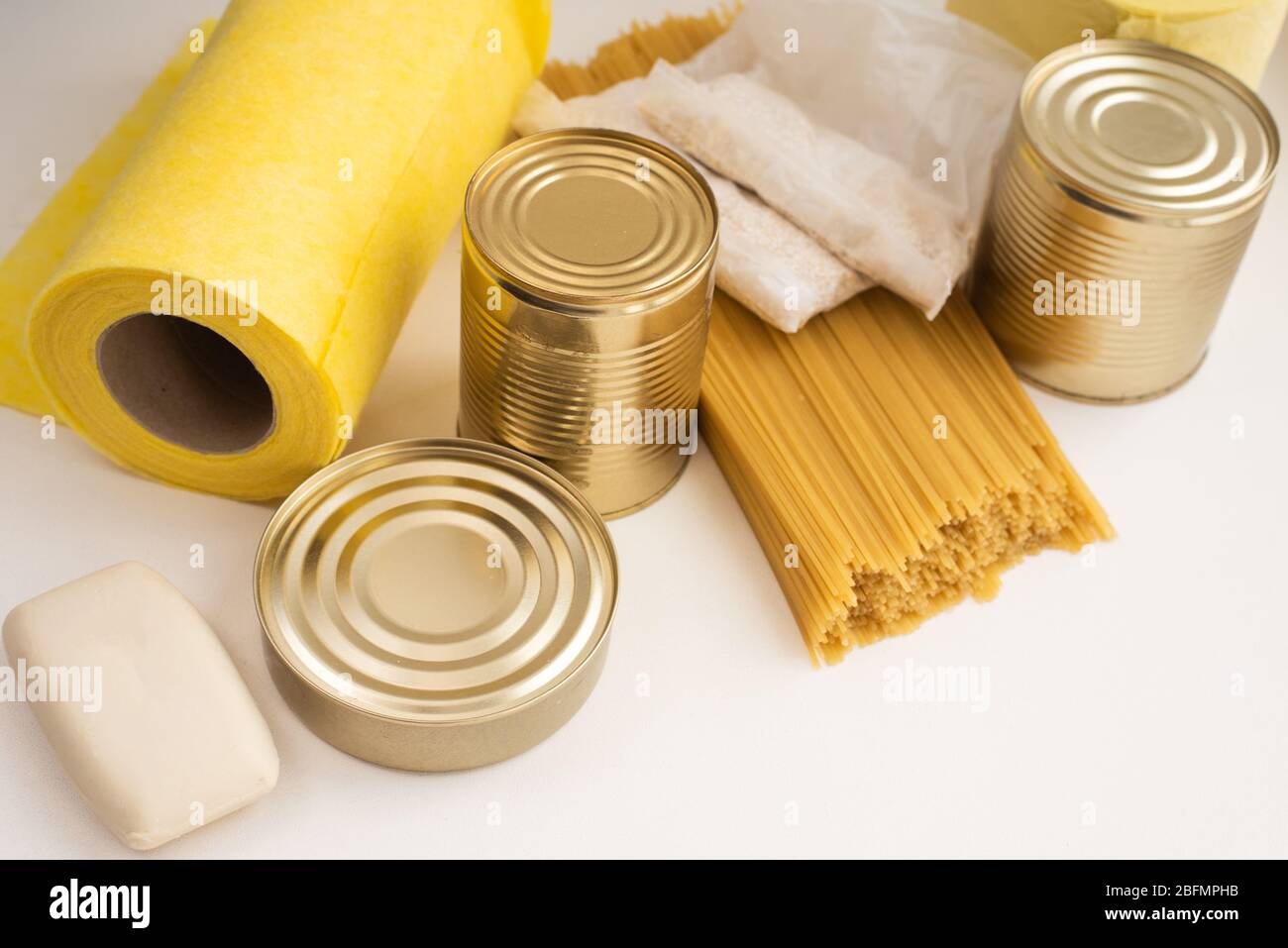 Cereals, various products, canned food, pasta and soap with place for text. Humanitarian assistance during the coronavirus pandemic. Stock Photo