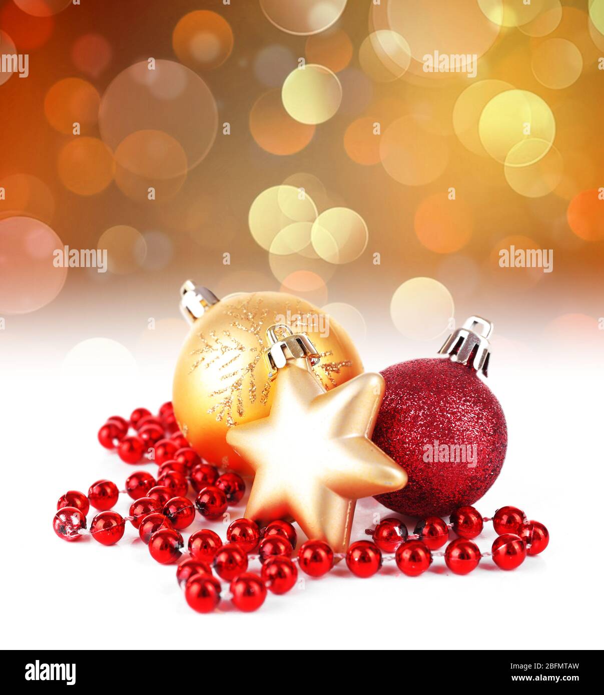 Christmas balls on shiny golden background Stock Photo - Alamy