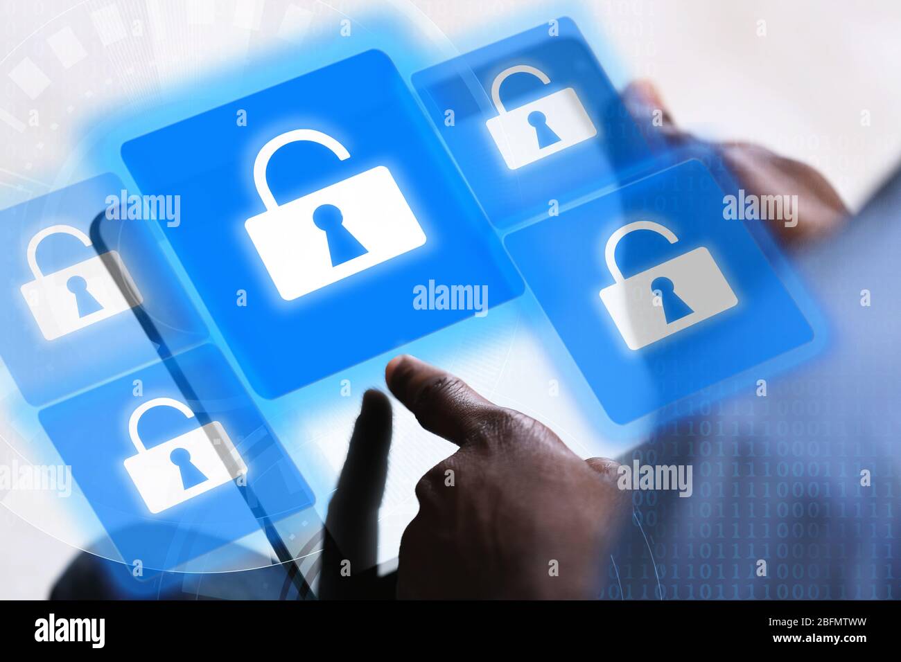 Man working with tablet-pc and icons security on virtual display. Technology, internet and networking concept. Stock Photo