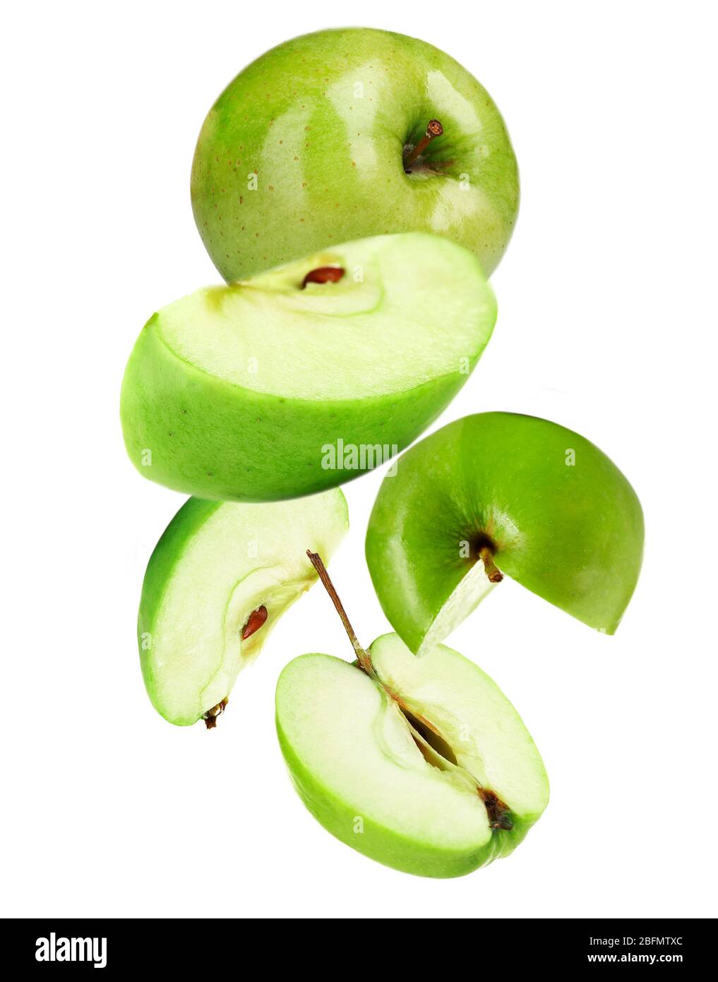 Falling ripe apples isolated on white Stock Photo