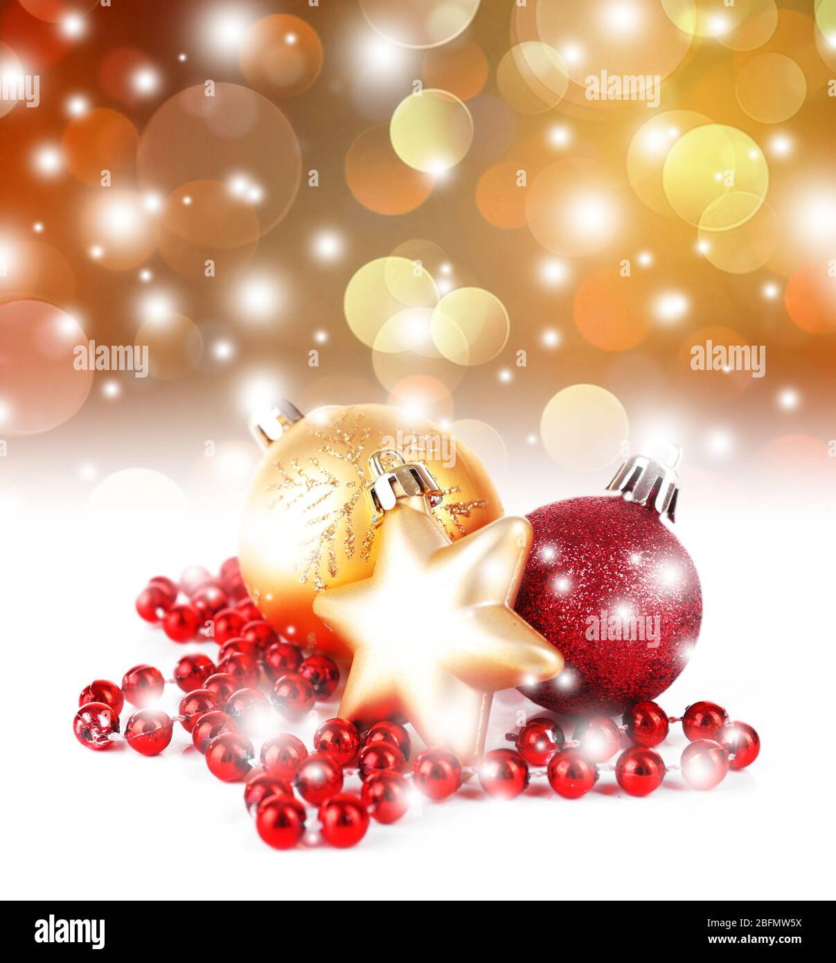 Christmas balls on shiny golden background Stock Photo - Alamy