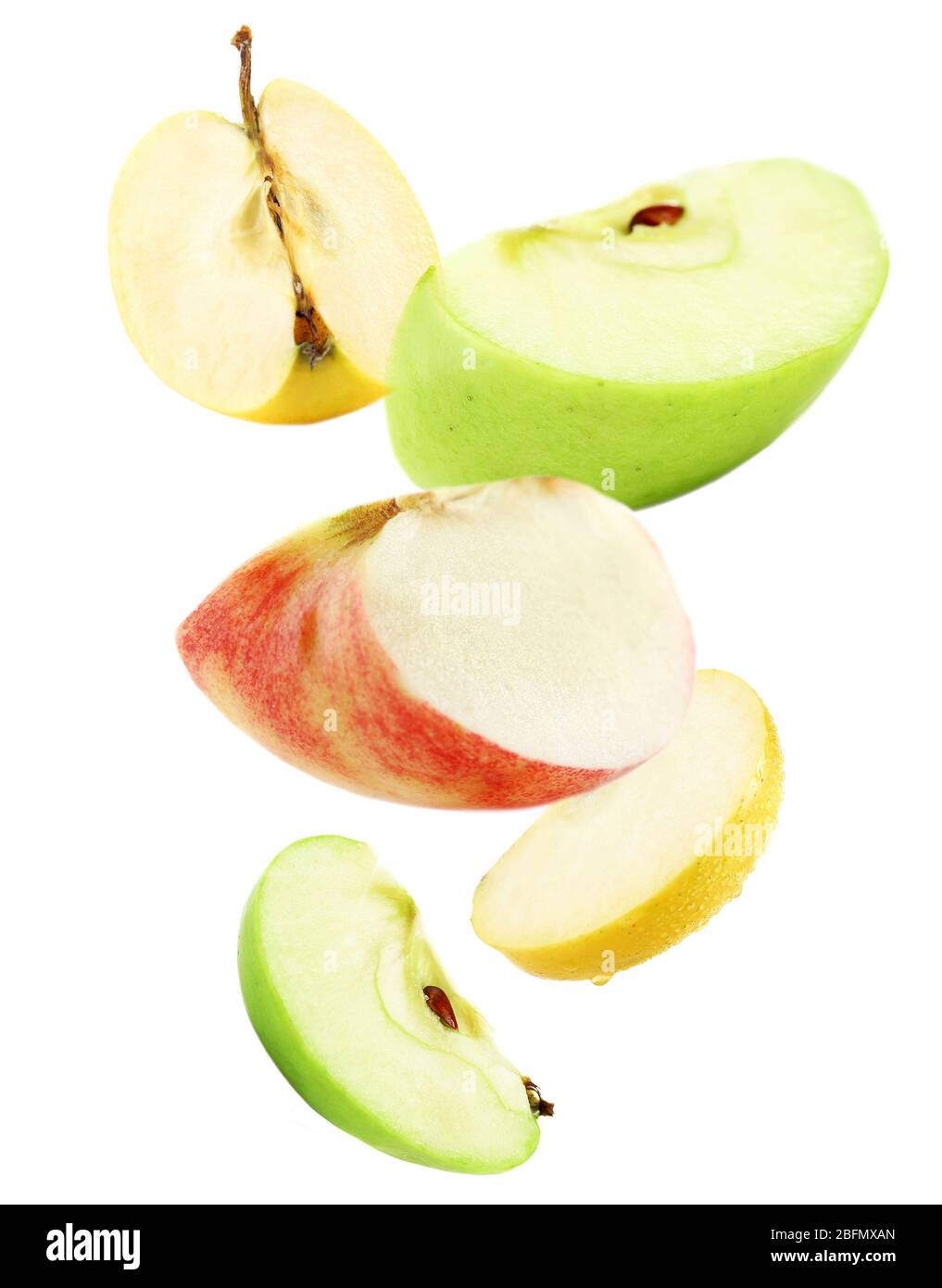 Falling ripe apples isolated on white Stock Photo