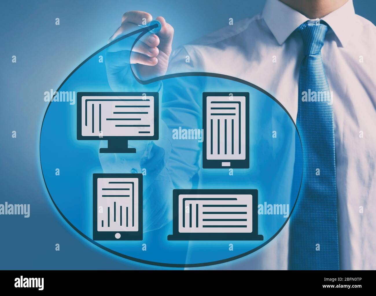 Man writing scheme with different devises Stock Photo