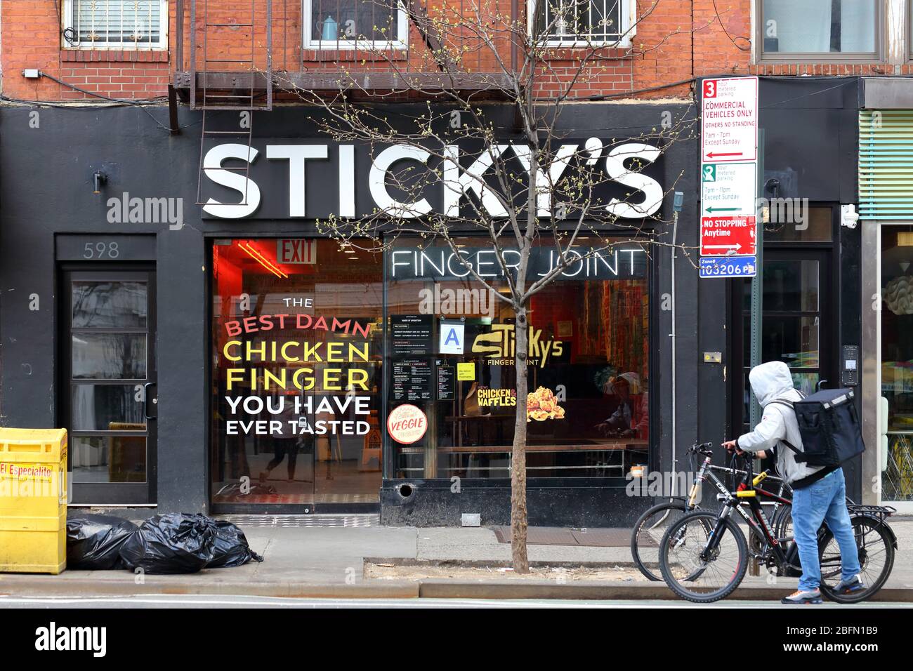 Sticky's Finger Joint, 598 9th Ave, New York, NY. exterior storefront of a chicken fingers restaurant in the Hells Kitchen neighborhood of Manhattan. Stock Photo