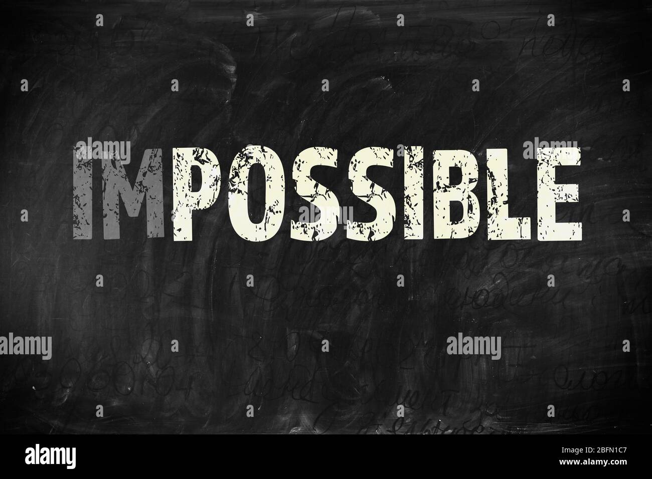 Word impossible transformed into possible on blackboard Stock Photo