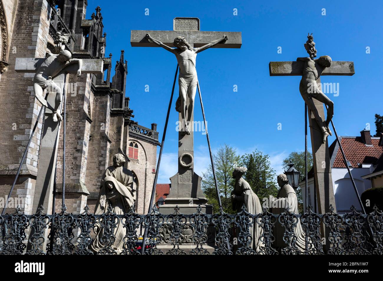 Sculptures of the crucifixion of Jesus next to the St. Victorian church Stock Photo