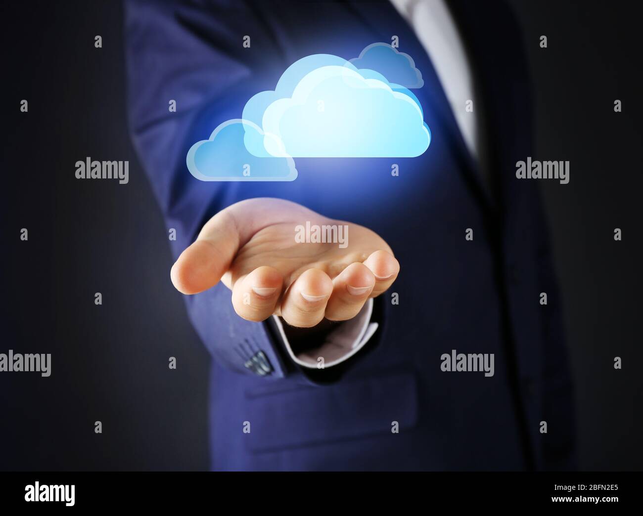 Virtual clouds on hand. Cloud storage concept with copy space Stock Photo