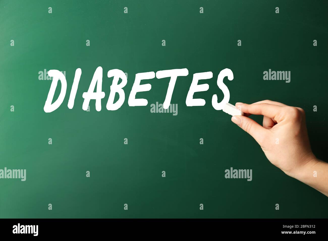 Female hand write Diabetes on blackboard Stock Photo - Alamy