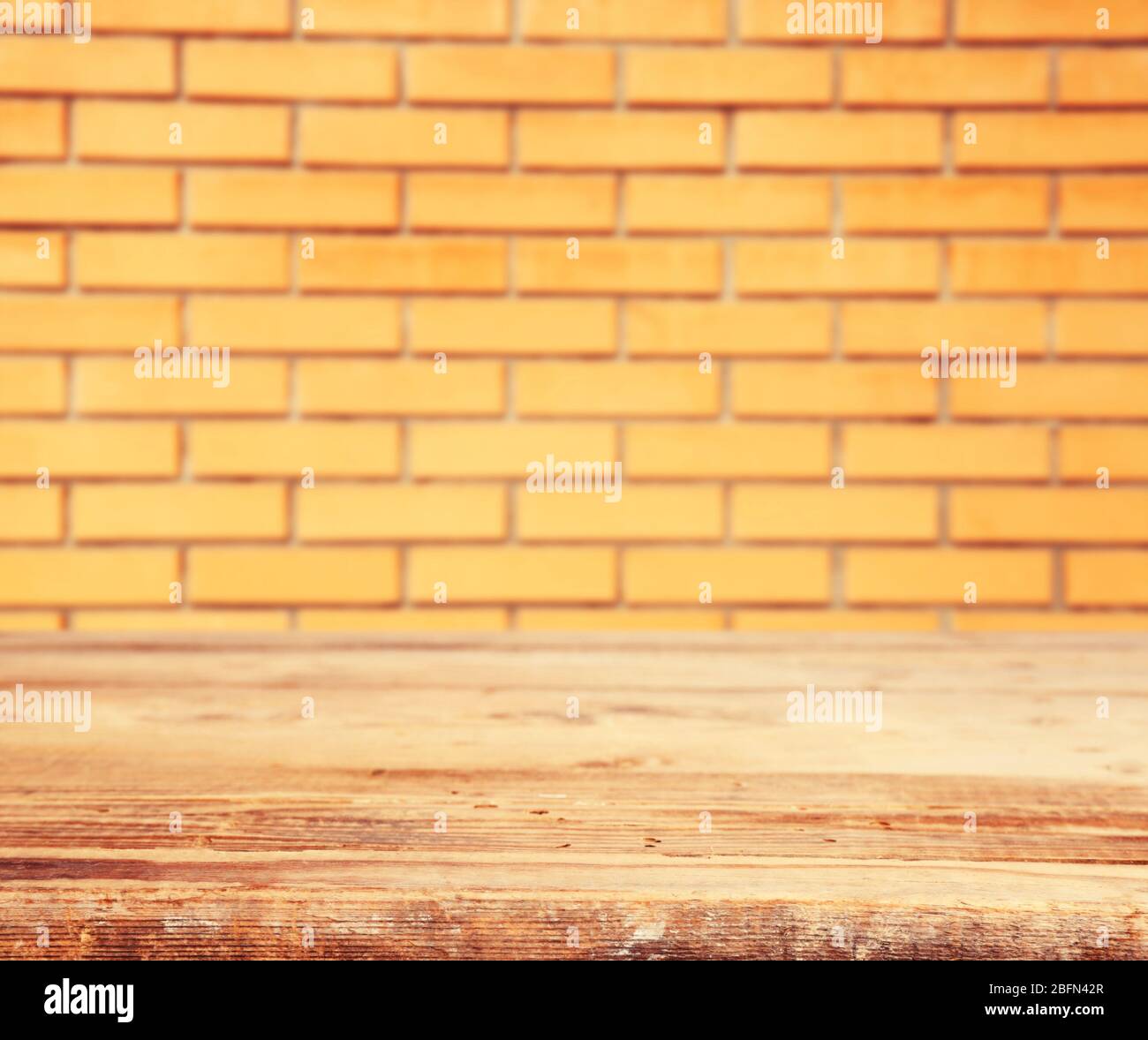 Wooden floor and brick wall background Stock Photo