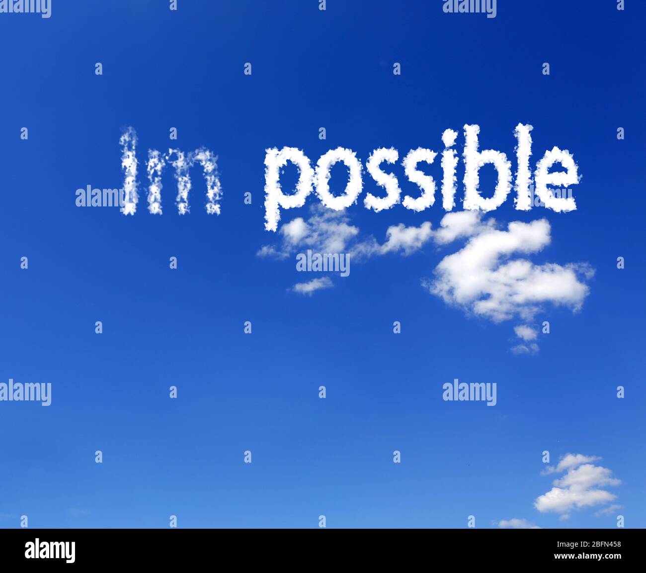 Word impossible transformed into possible on blue sky Stock Photo