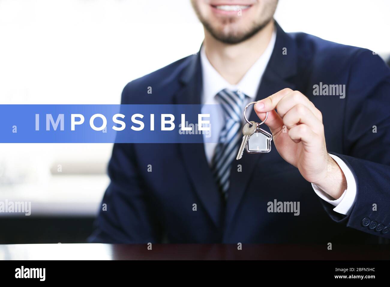Human hand turning word impossible into possible Stock Photo