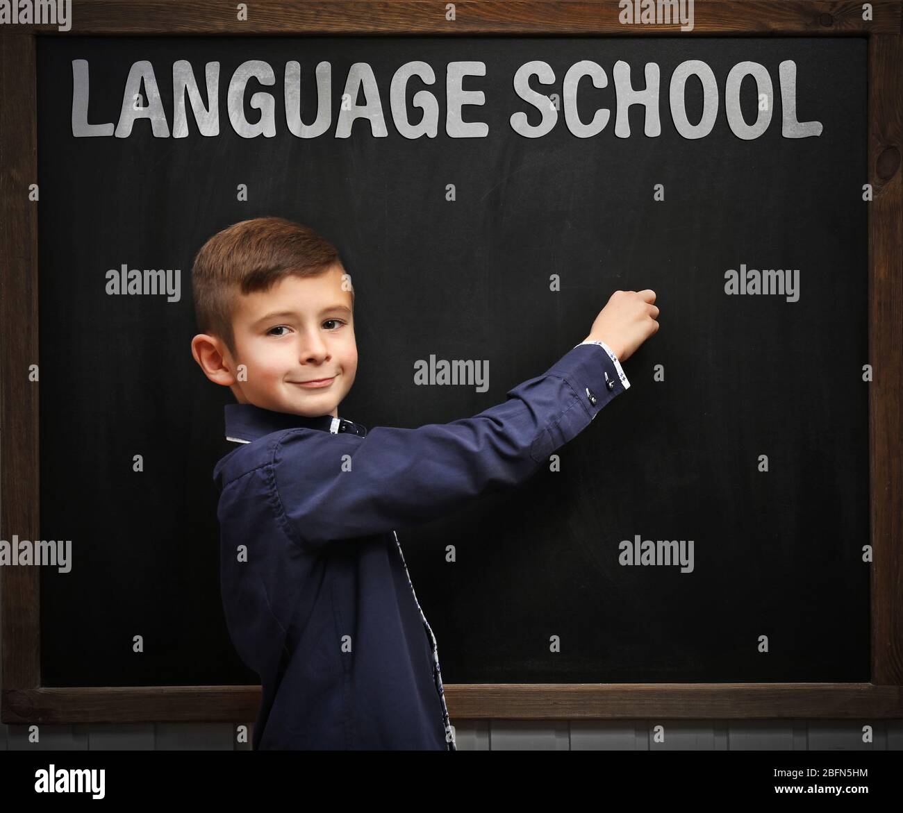 Language school concept with schoolboy Stock Photo