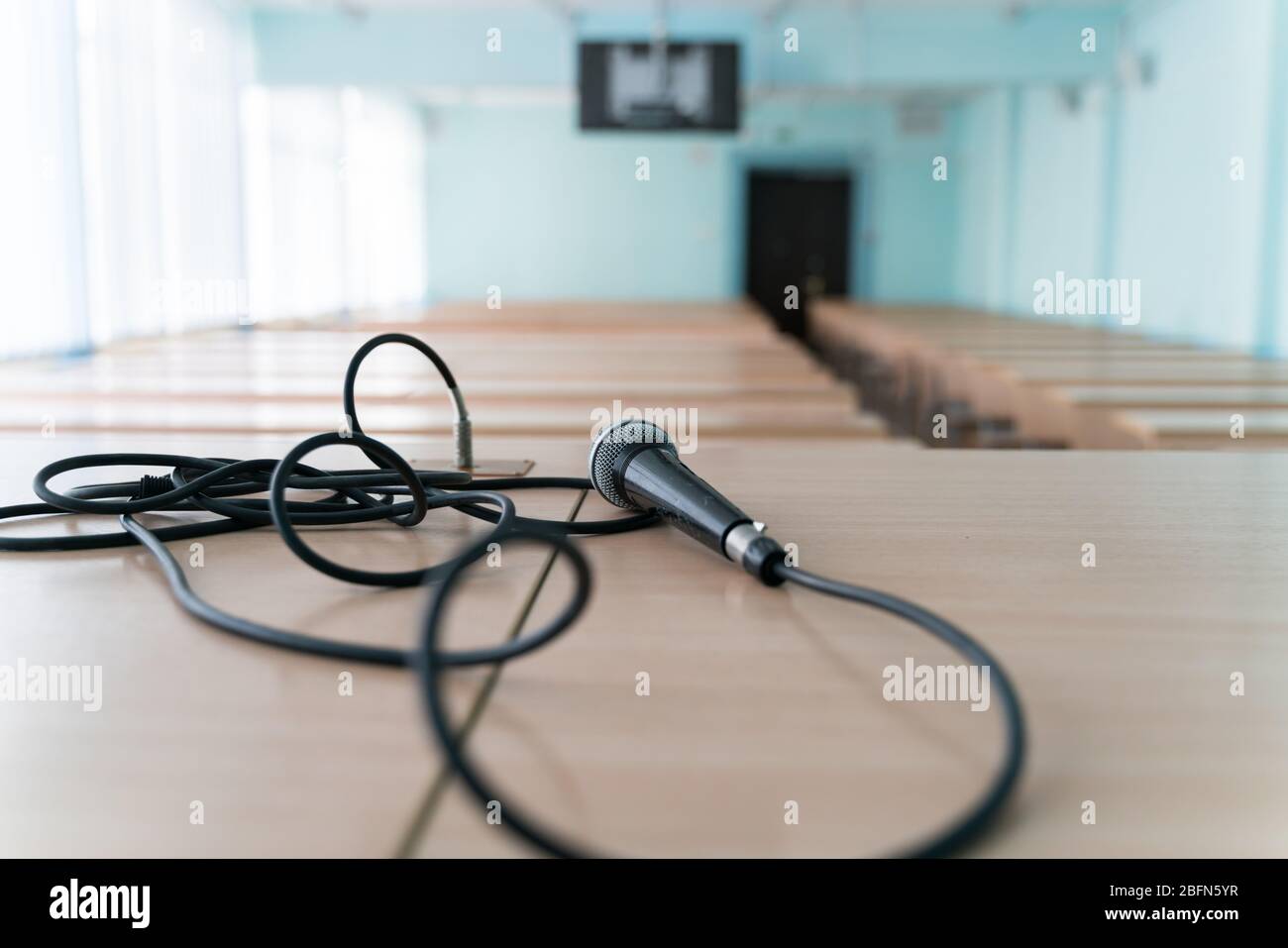 microphone on a table in an empty classroom for lectures at the university Stock Photo