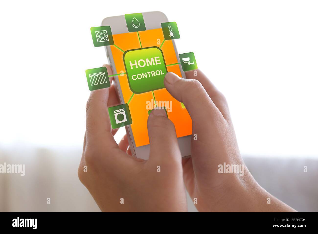 Using smart home app on phone. Smart home control concept Stock Photo ...