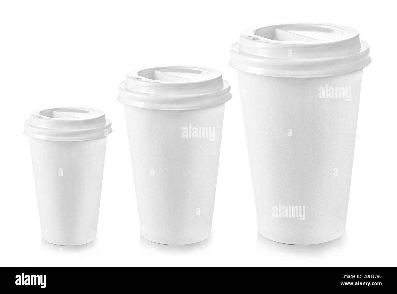 Three paper cups different sizes isolated on white Stock Photo - Alamy