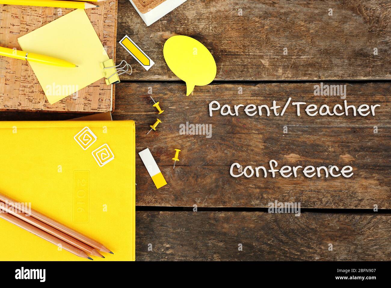 Stationary with text PARENT/TEACHER CONFERENCE on wooden background. School concept. Stock Photo