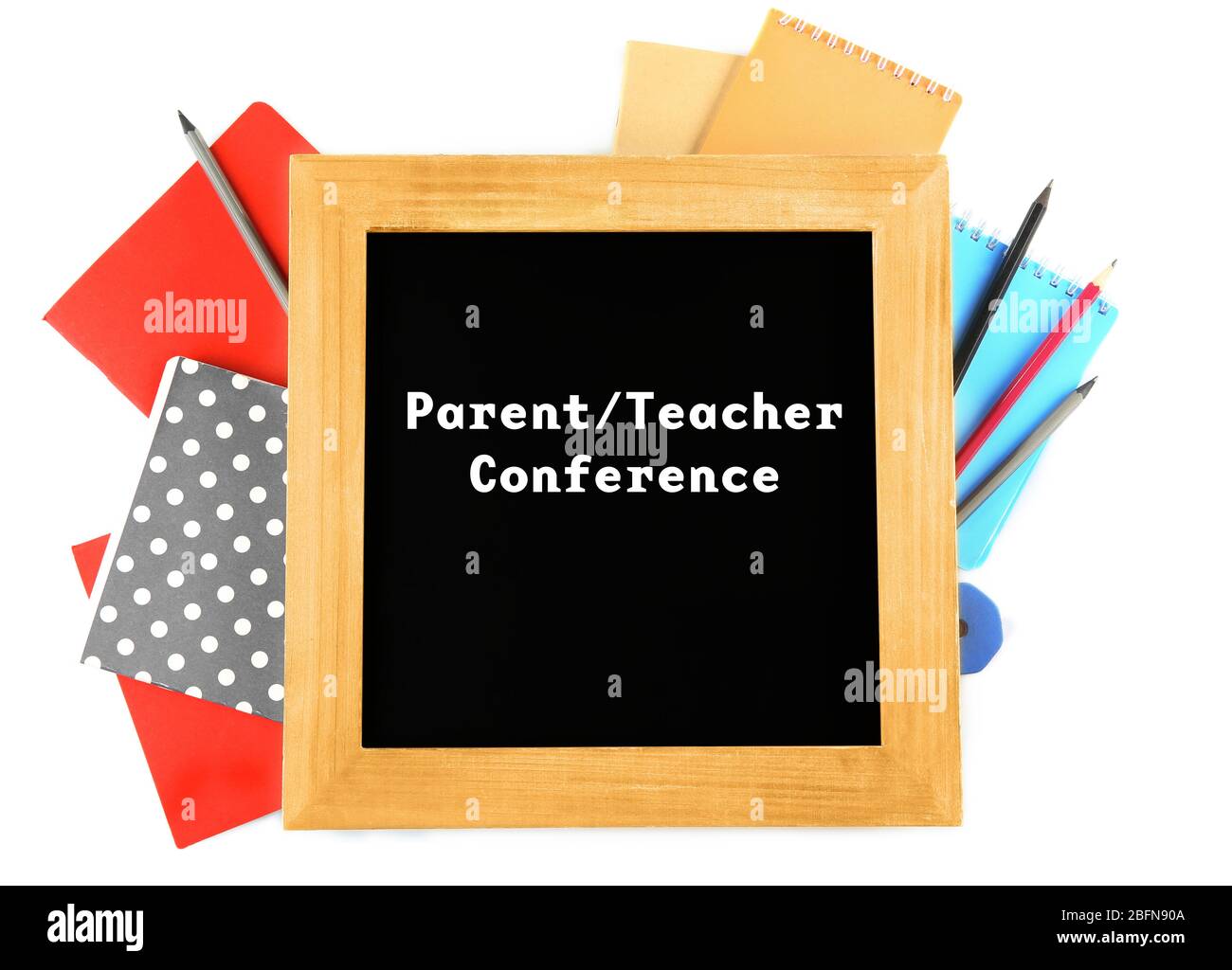 Blackboard with text PARENT/TEACHER CONFERENCE and stationery on white background. School concept. Stock Photo