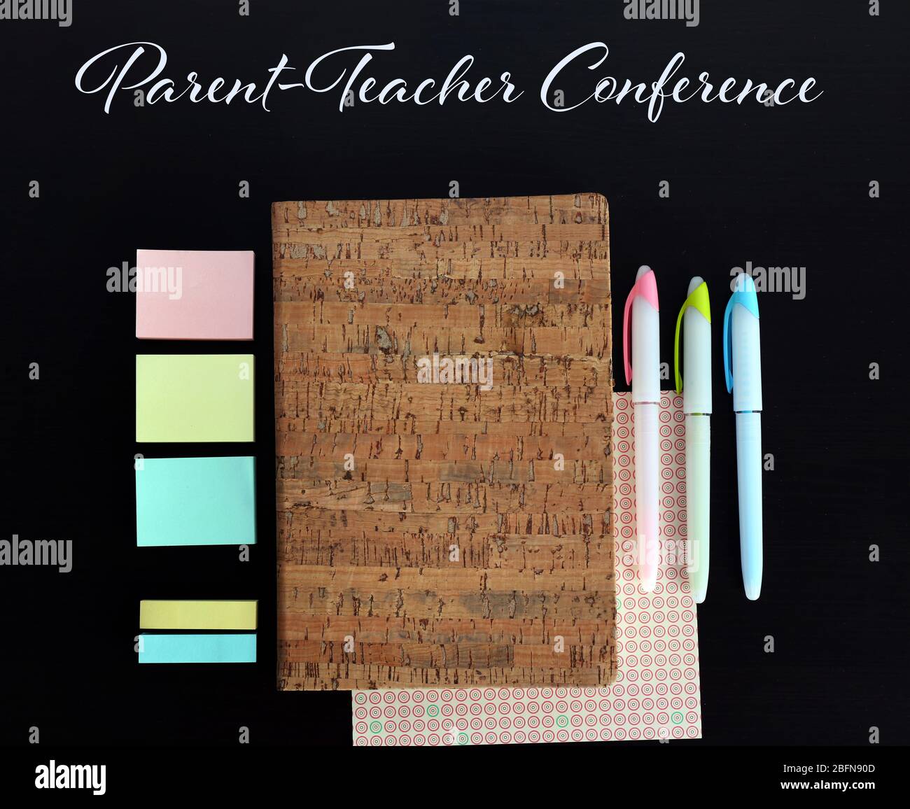 Text PARENT-TEACHER CONFERENCE and stationary on black background. School concept. Stock Photo