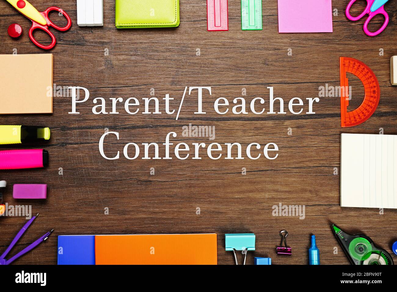 Text PARENT/TEACHER CONFERENCE  with stationary on  wooden background. School concept. Stock Photo