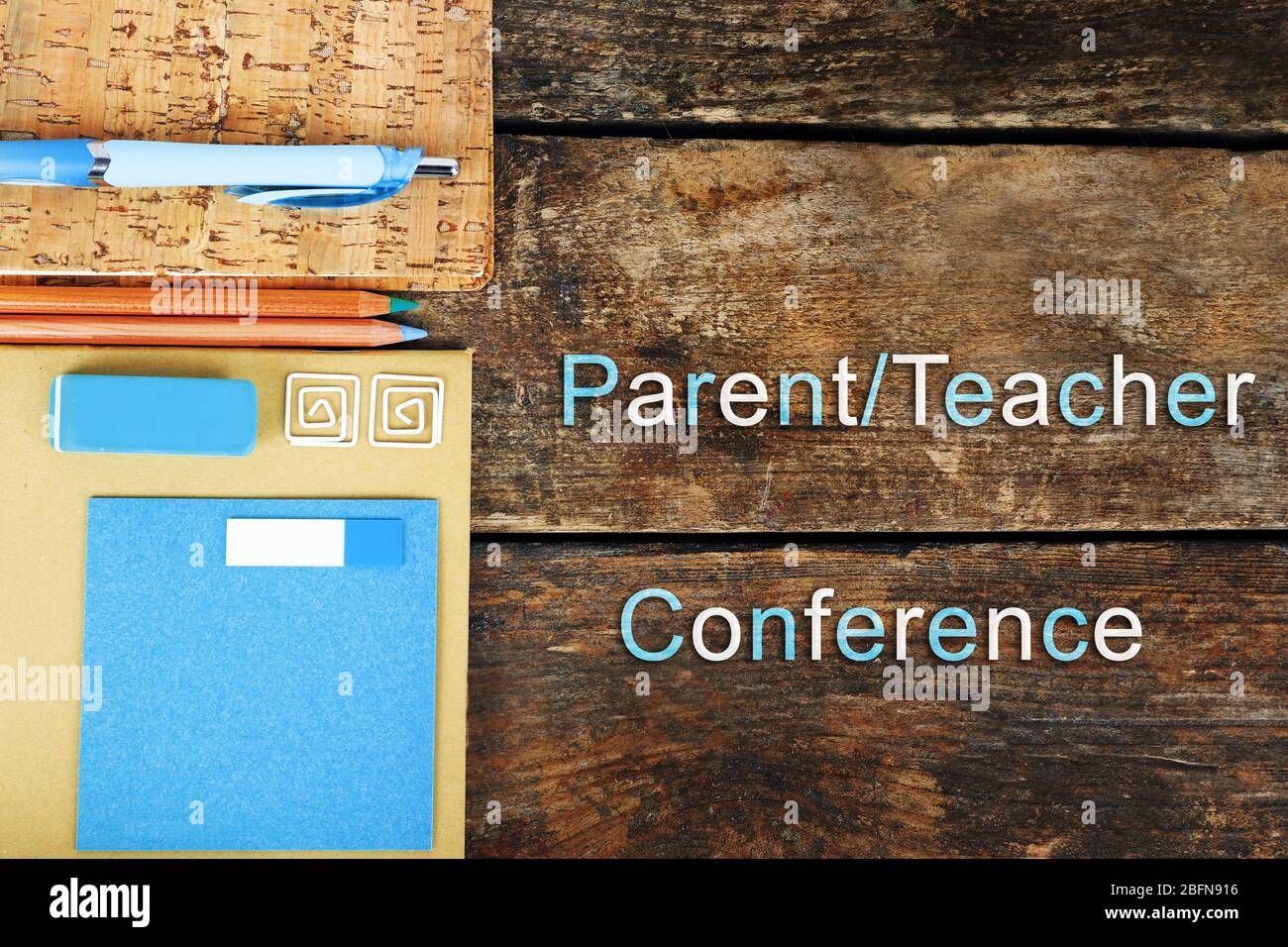Stationary with text PARENT/TEACHER CONFERENCE on wooden background. School concept. Stock Photo