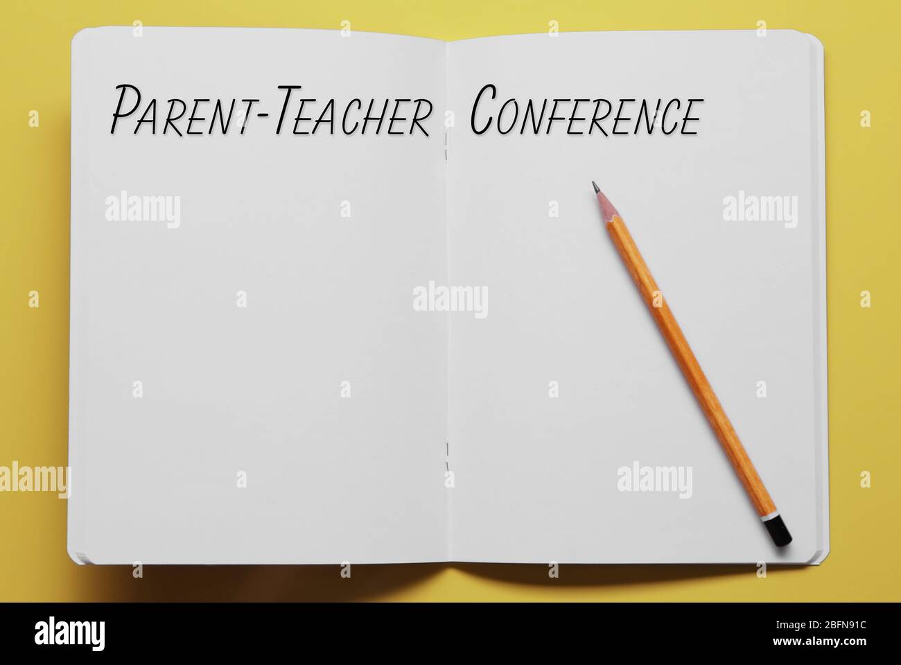 Text PARENT-TEACHER CONFERENCE written in notebook. Yellow background. School concept. Stock Photo