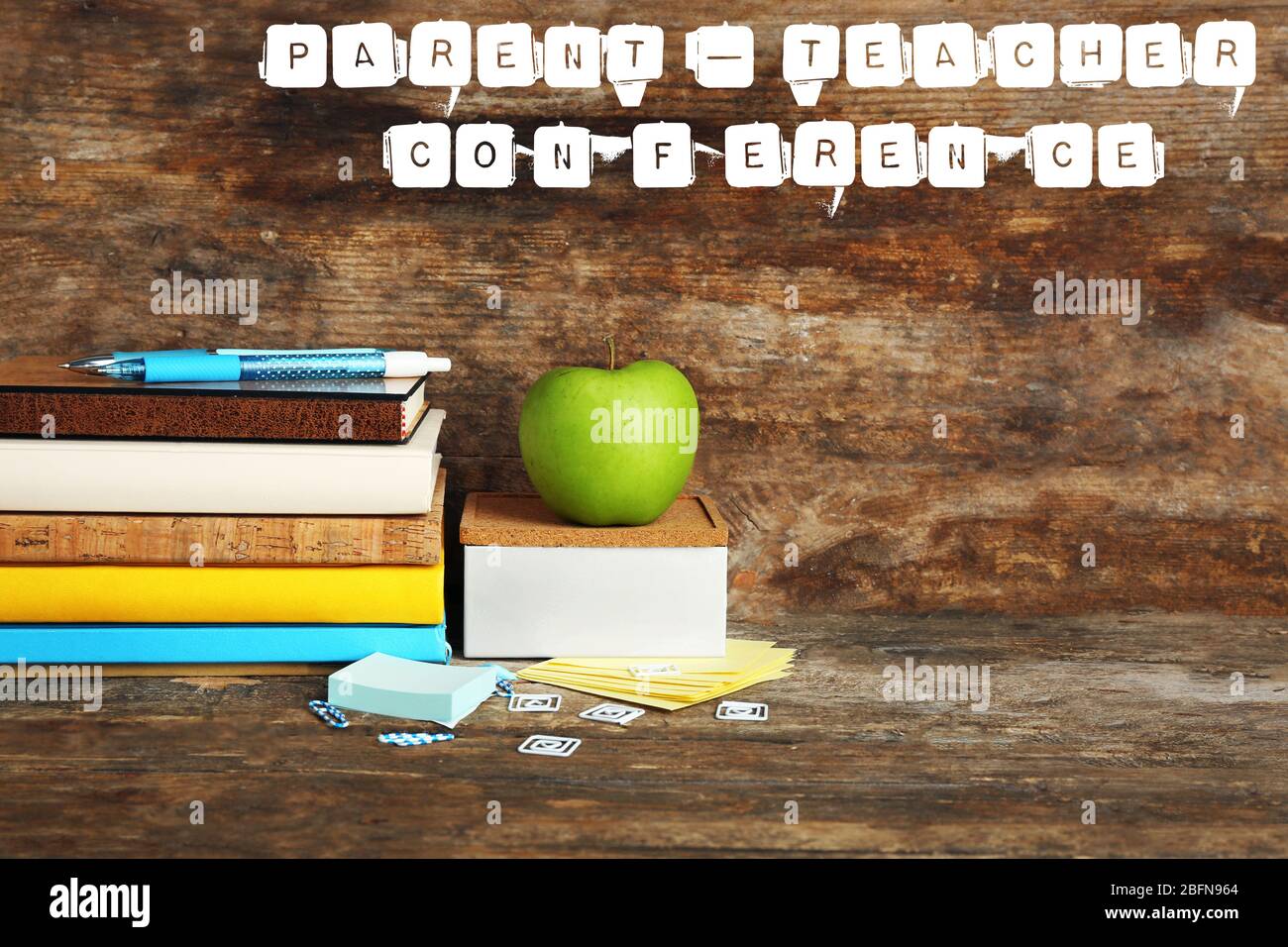 Stationary with text PARENT-TEACHER CONFERENCE on wooden background. School concept. Stock Photo