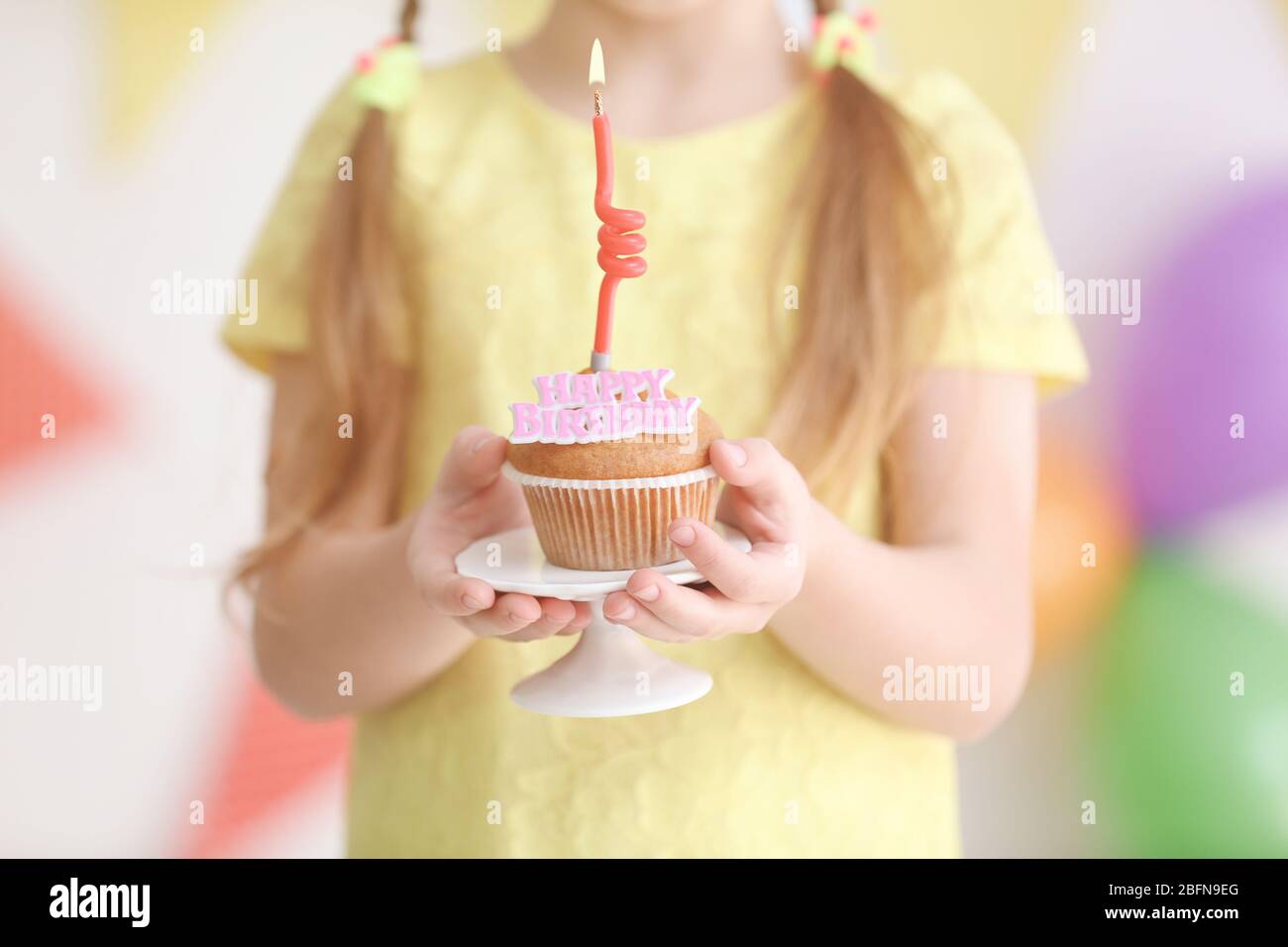 Little girl holding birthday cake with candle, closeup Stock Photo Alamy